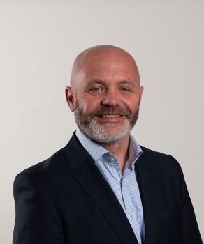 Chief Executive, Alan Russell headshot smiling to camera