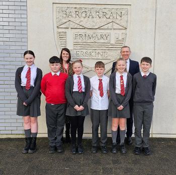 Six Bargarran Primary School pupils with head teacher Alistair Lyle and depute head teacher  J Thompson