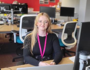 Aimee Drysdale Modern Apprentice_seated at her desk in ICT