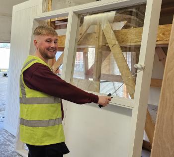 Robbie Edgar priming a door